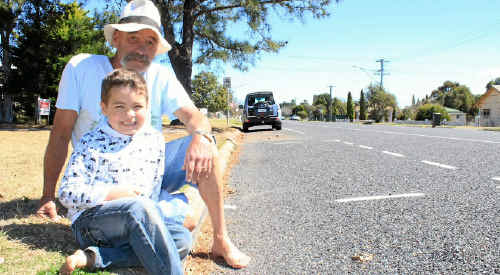 Pratten St resident Lee Collins, with grandson Dexta Wood, wasn’t fazed about the new parking bays marked outside his home. Pratten St resident Lee Collins, with grandson Dexta Wood, wasn’t fazed about the new parking bays marked outside his home.